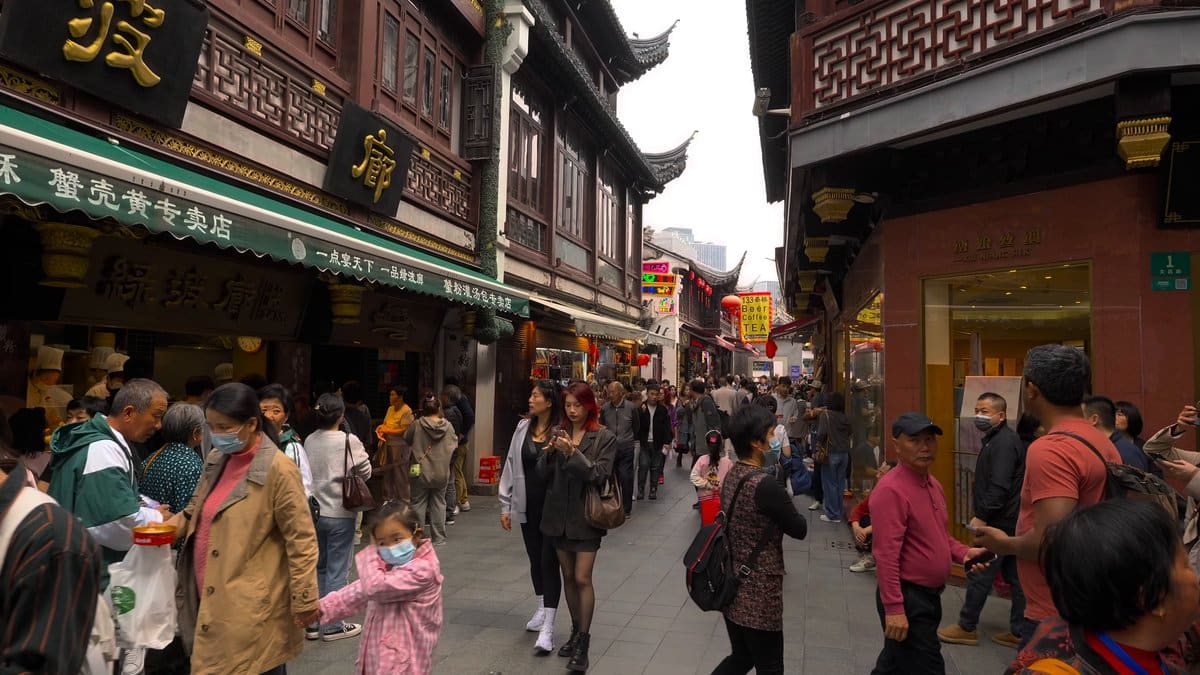 A bazaar street with green and gold shop