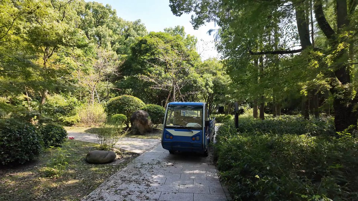 A blue electric shuttle cart parked on the