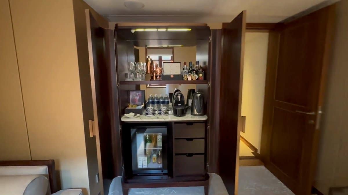 A cabinet opened to show the minibar —