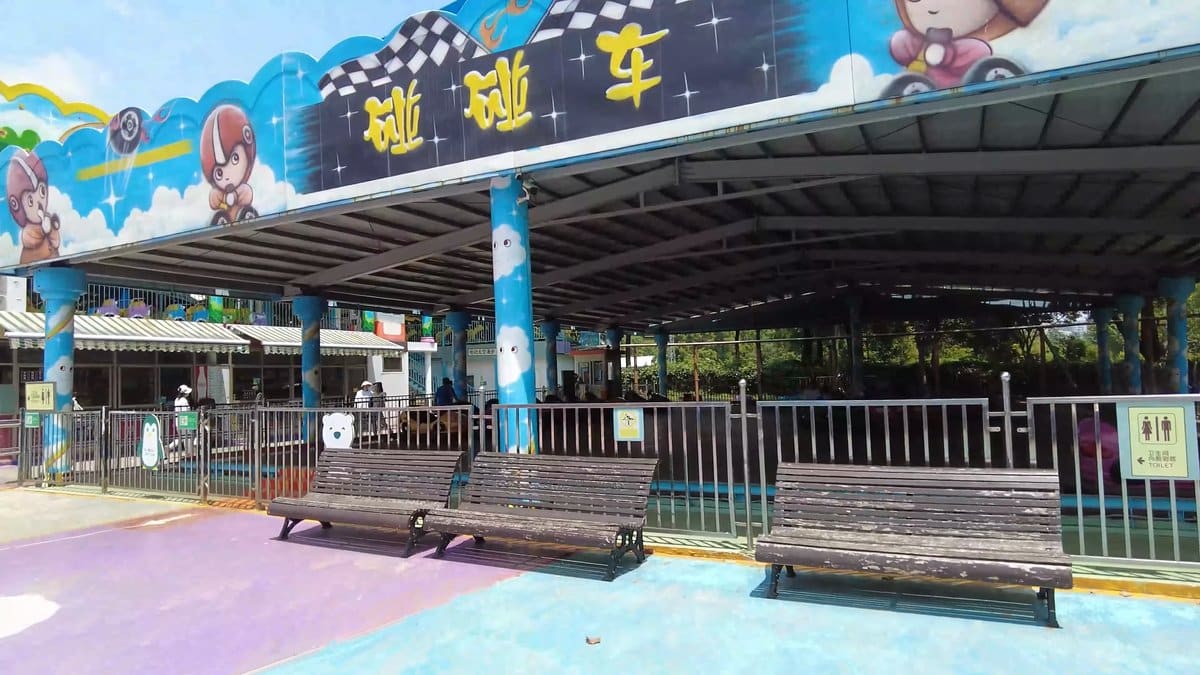 A covered ride enclosure with a bright painted