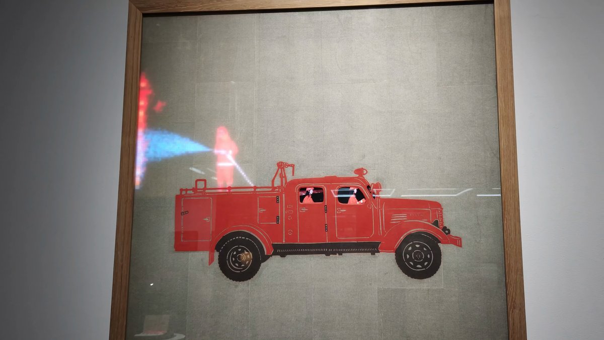 A framed relief artwork of a red fire