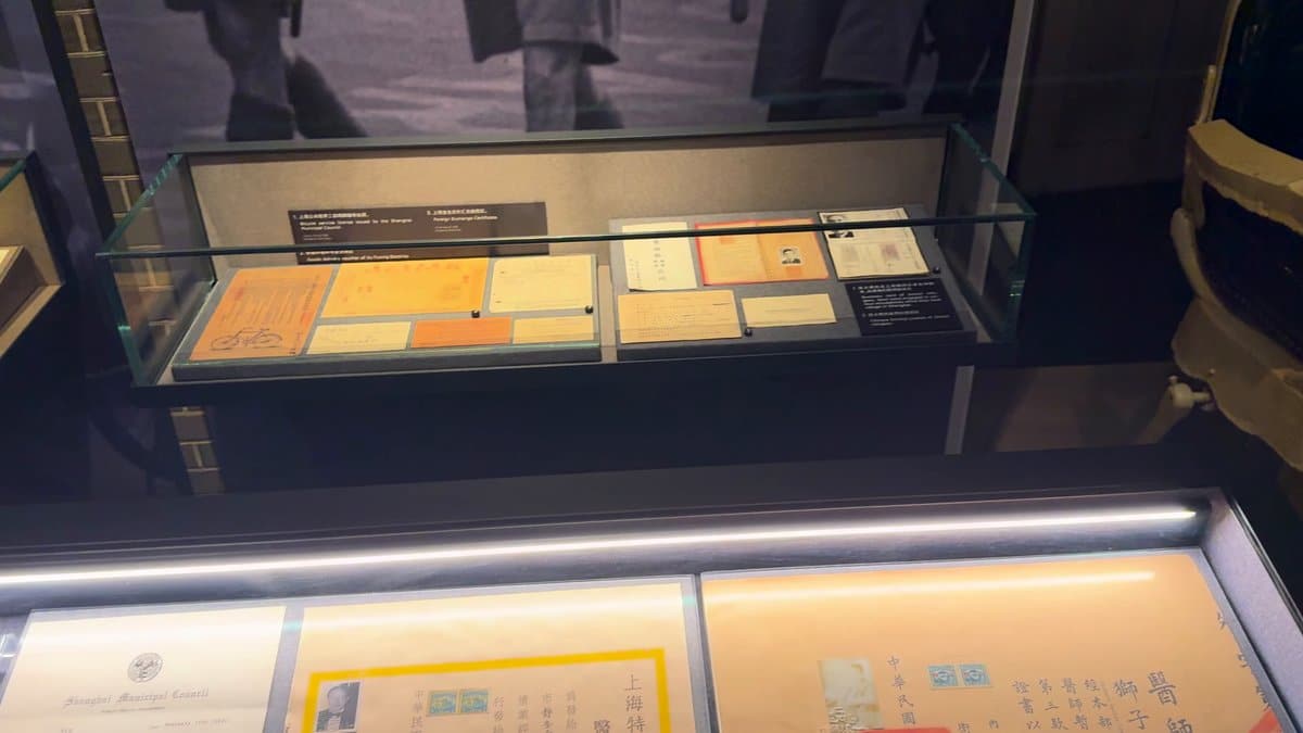 A glass case of loose documents and papers