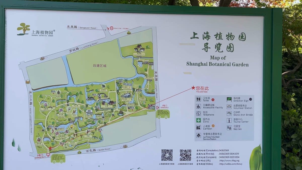 A green-framed orientation board carrying the site plan