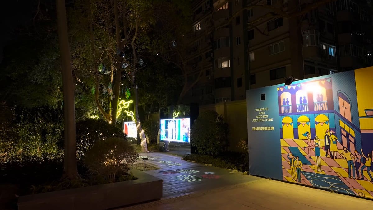 A hoarding painted with a colourful mural, the