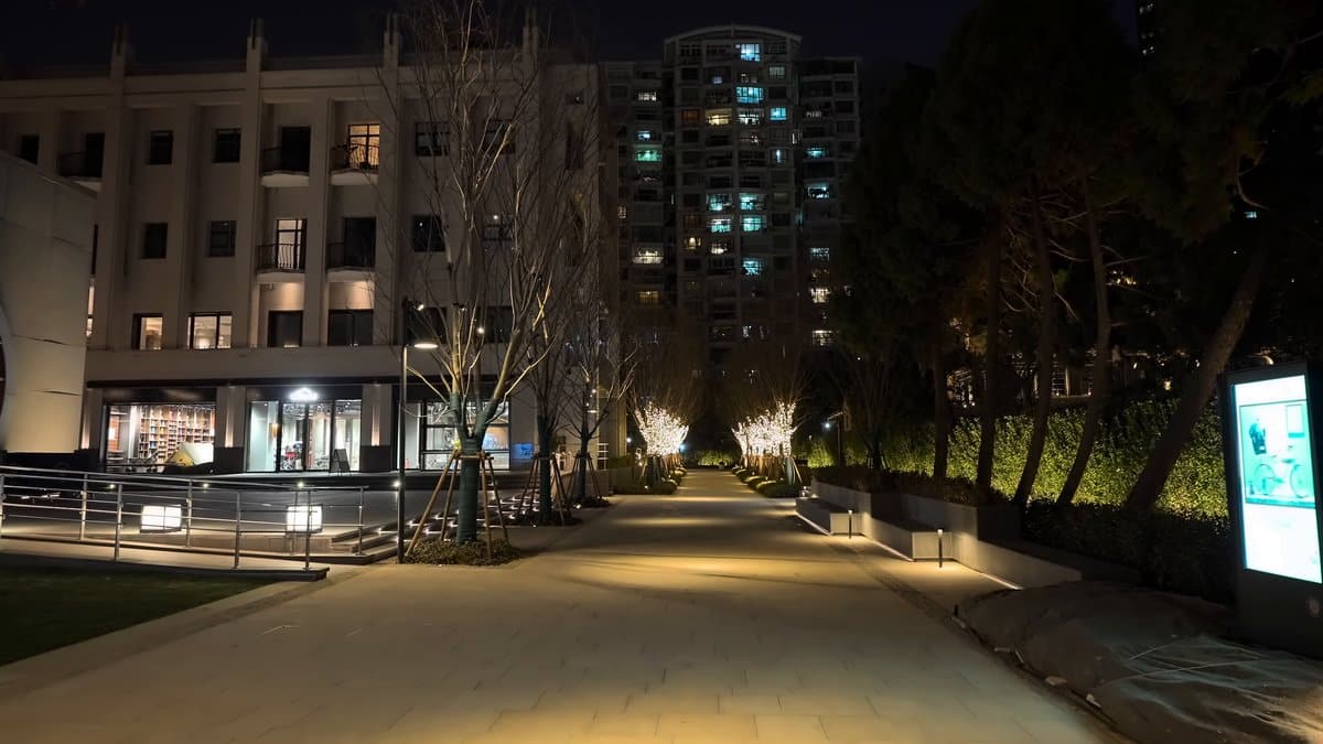 A lane at night with an illuminated information