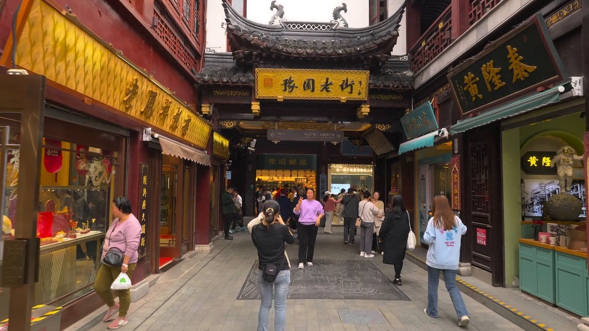 A lane of gilded shop boards with a