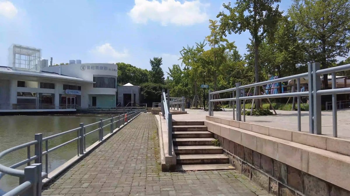 A modern white building with a ramp and
