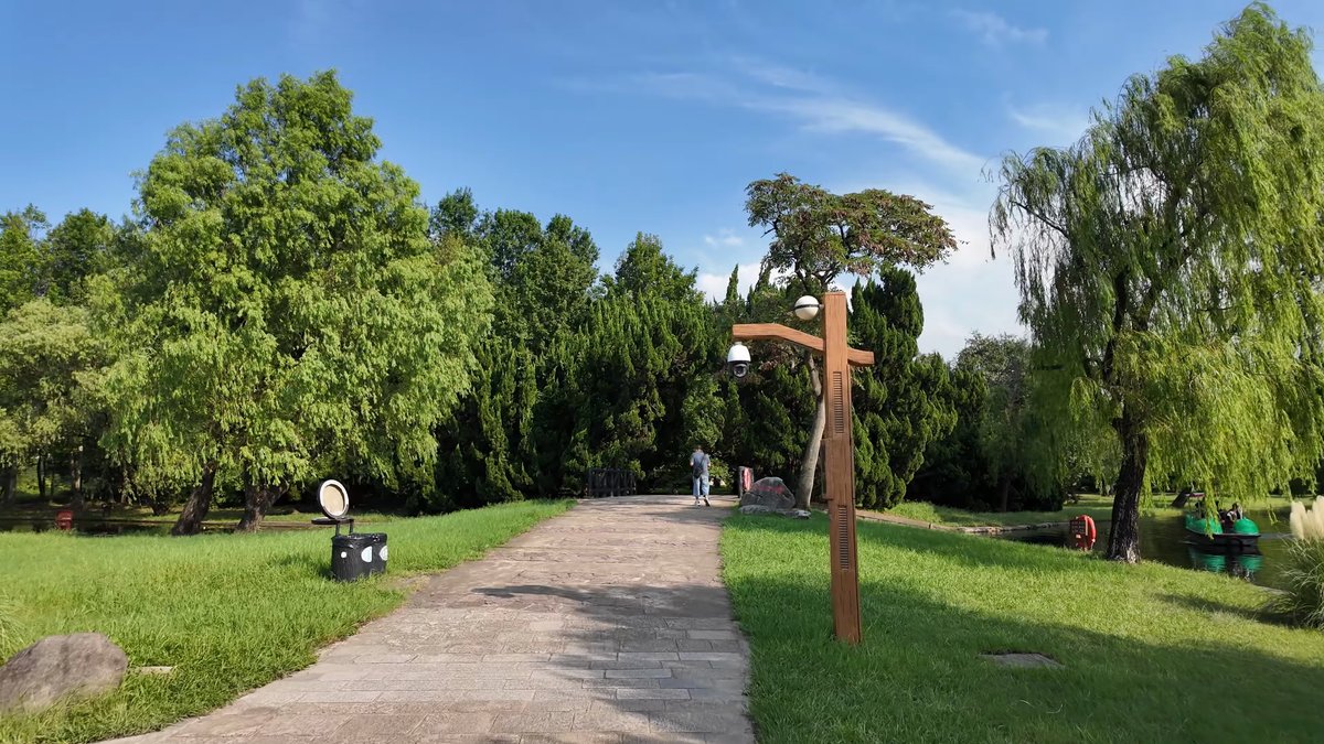 A path with a carved wooden post beside