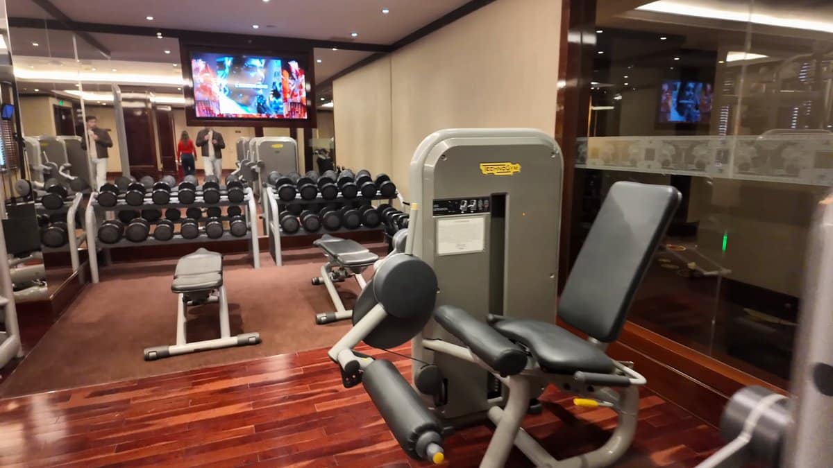 A screen on the gym wall above the