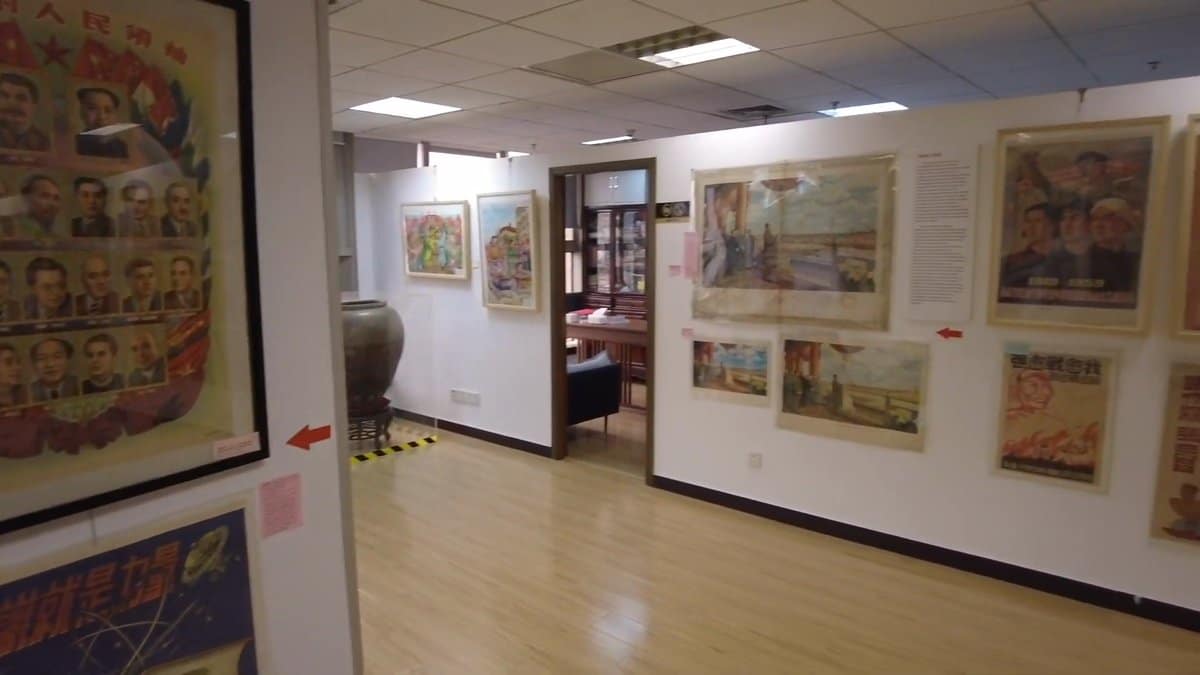 A wider gallery view, framed works along the