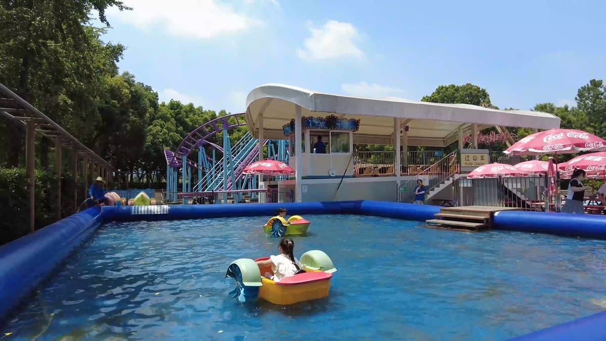 An amusement area with a blue pool, a