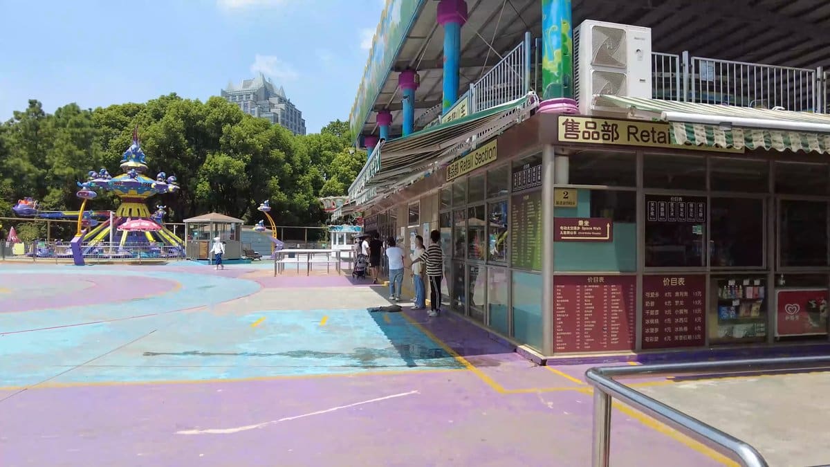 An amusement plaza with a shop unit signed