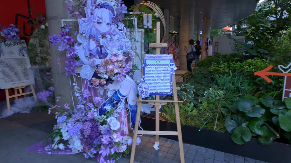 An elaborate floral and balloon display in pinks