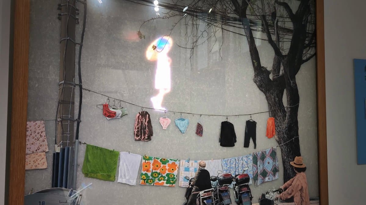 An outdoor display of printed cloths and garments