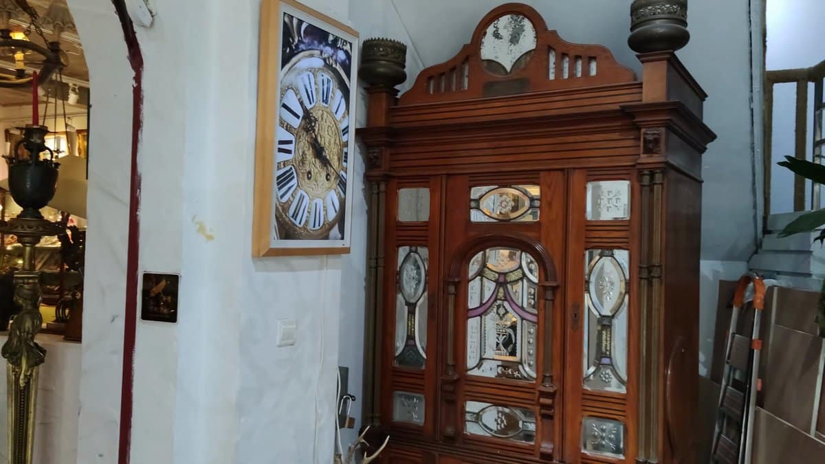 Antique clocks and carved cabinets