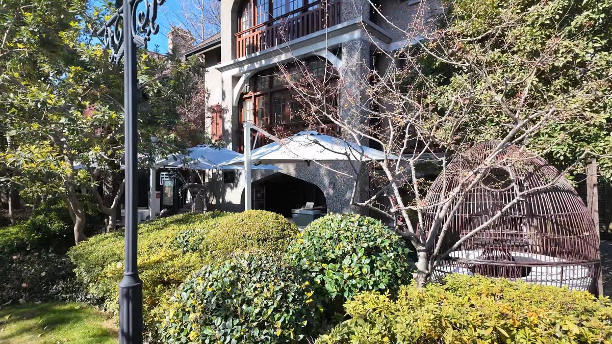 Arched villa entrance and parasols