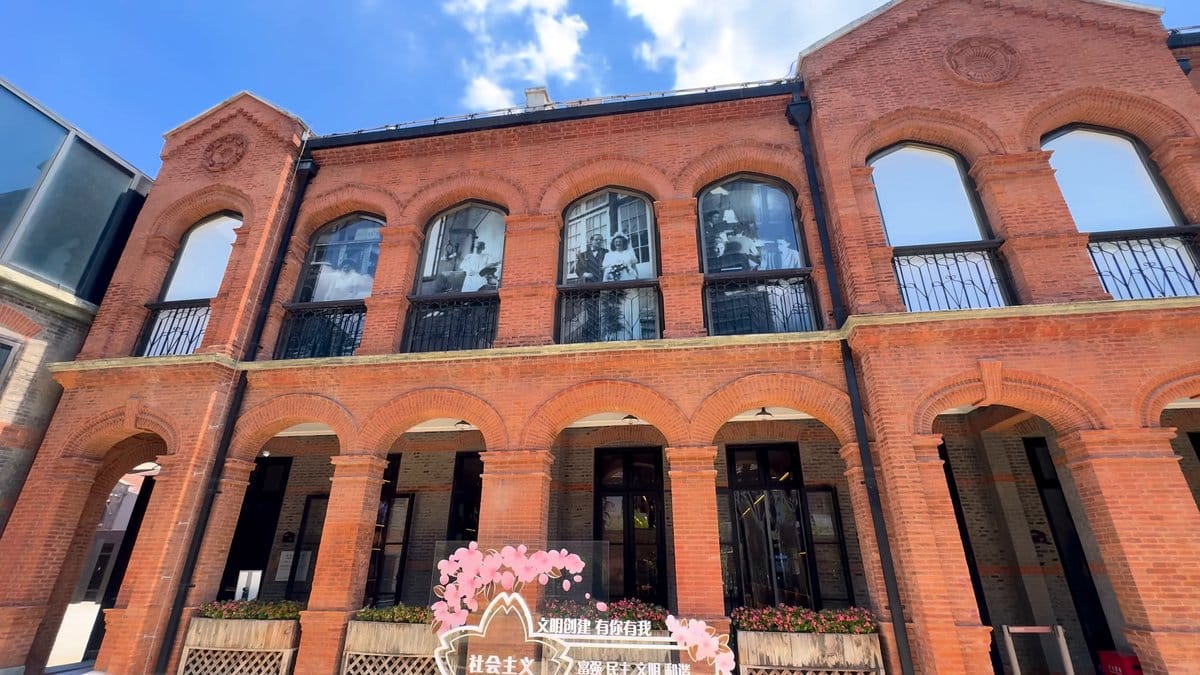 Arched windows and pink planters