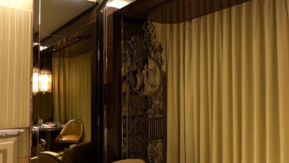 Armchair beside a carved screen