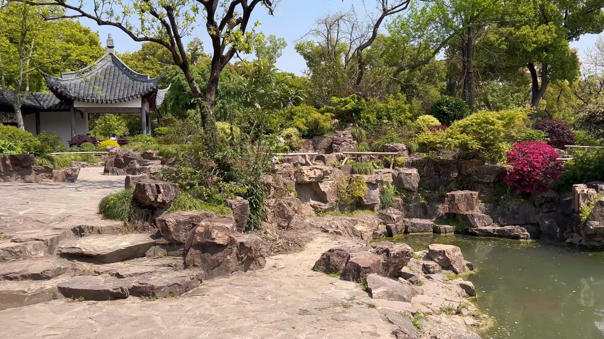 Azaleas beside a tiled pavilion