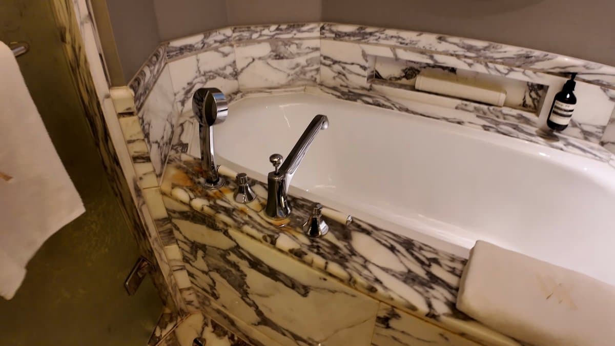 Bathtub set in marble surround