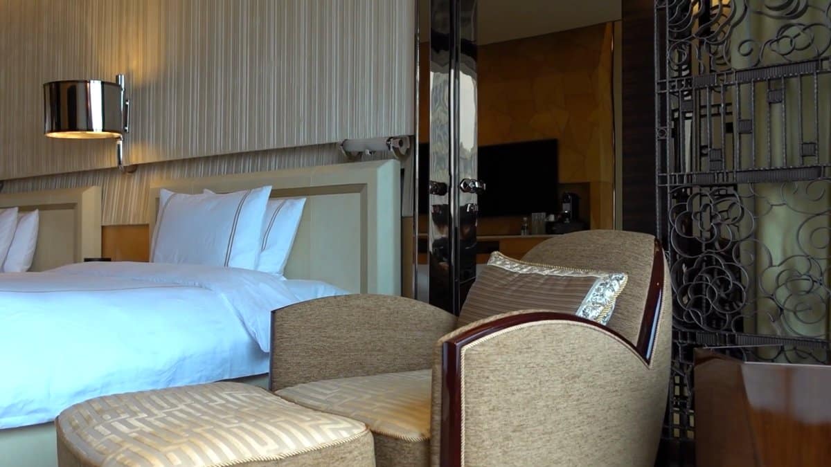 Bed beside decorative metal screen