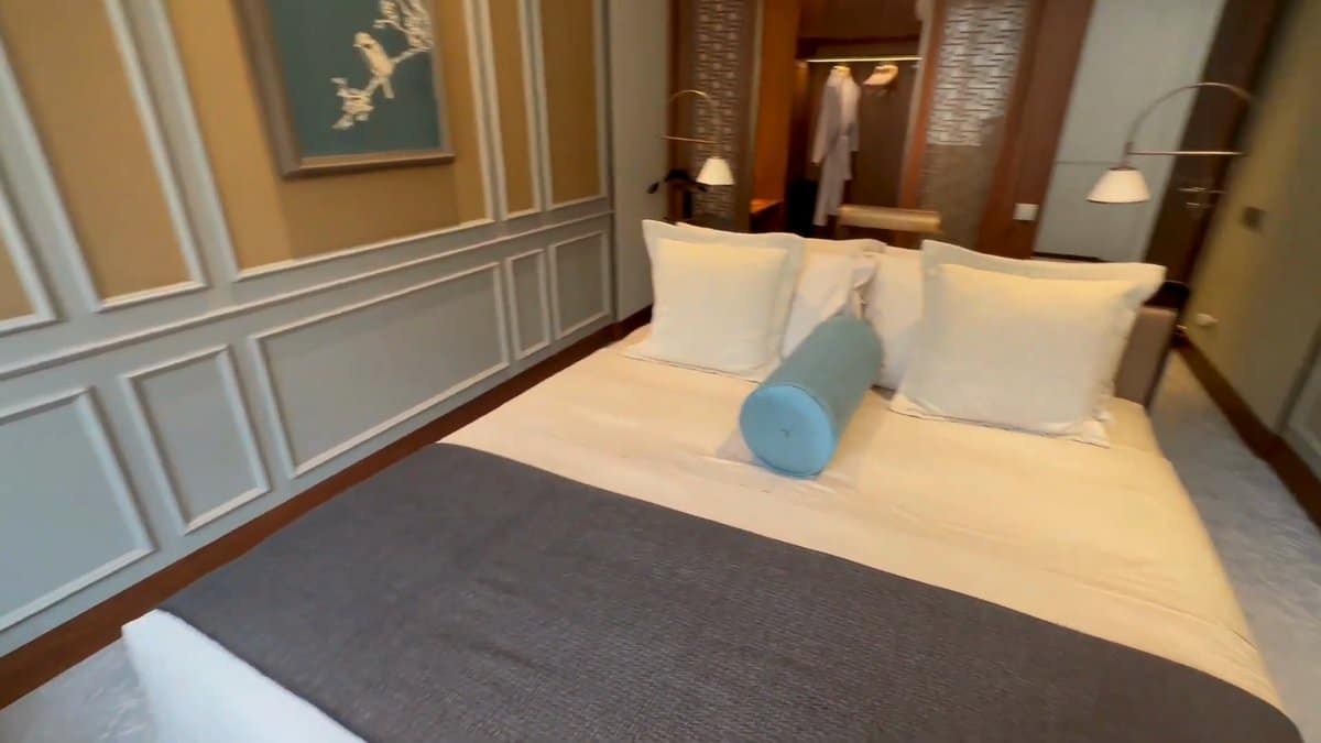 Bed with robe hanging nearby