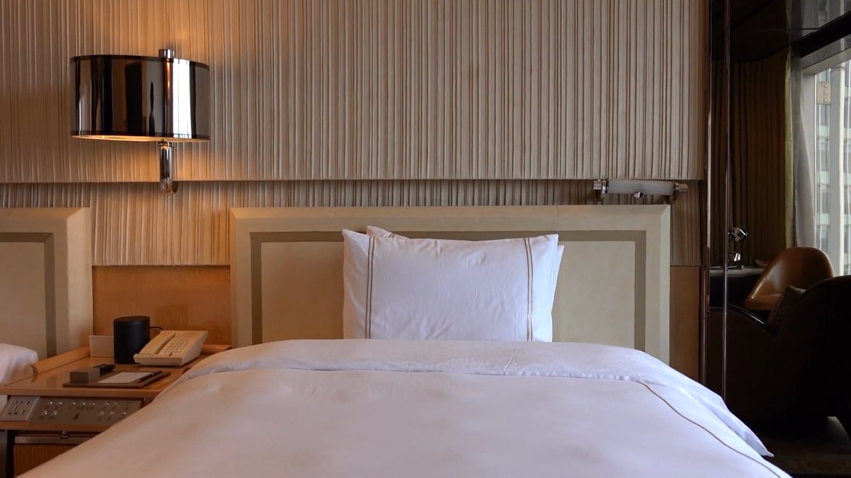 Bed with stacked white pillows