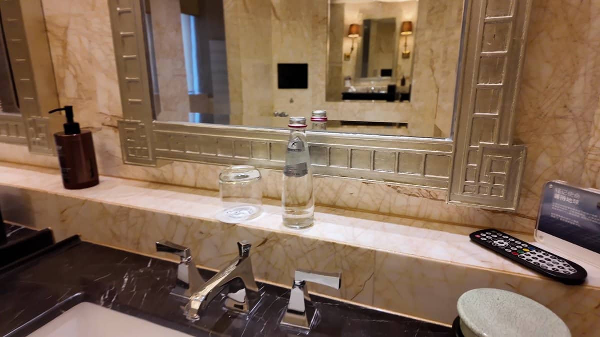 Black marble vanity gold tap