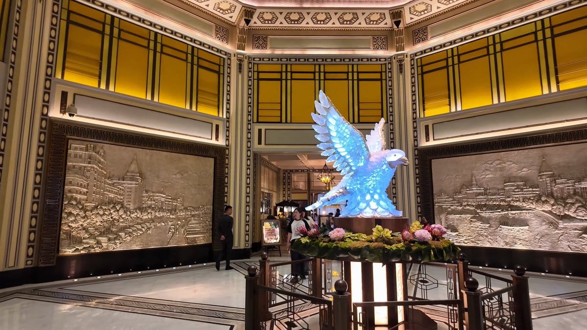 Blue glass bird lobby sculpture