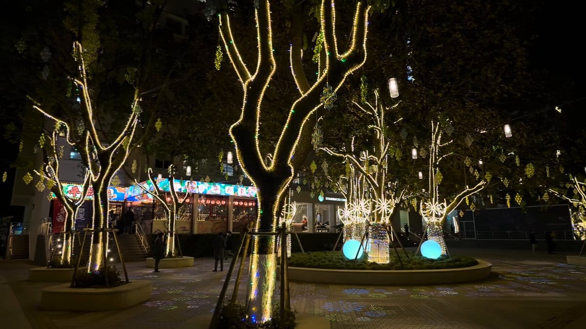Blue sphere among illuminated trees