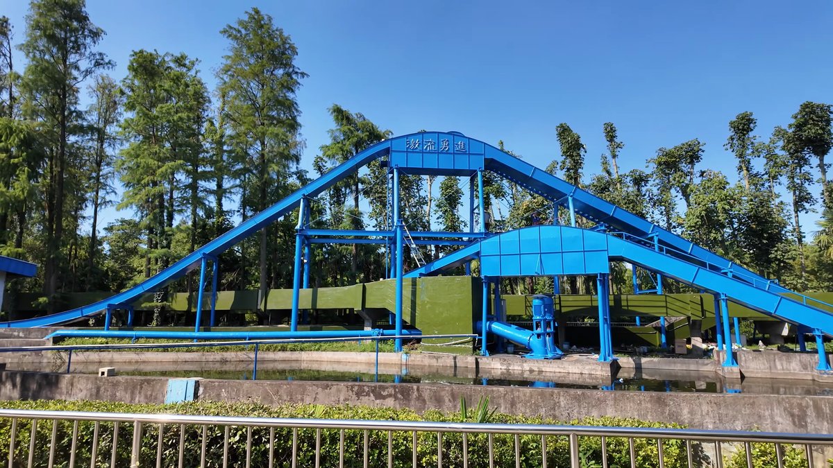 Blue water flume above the treetops