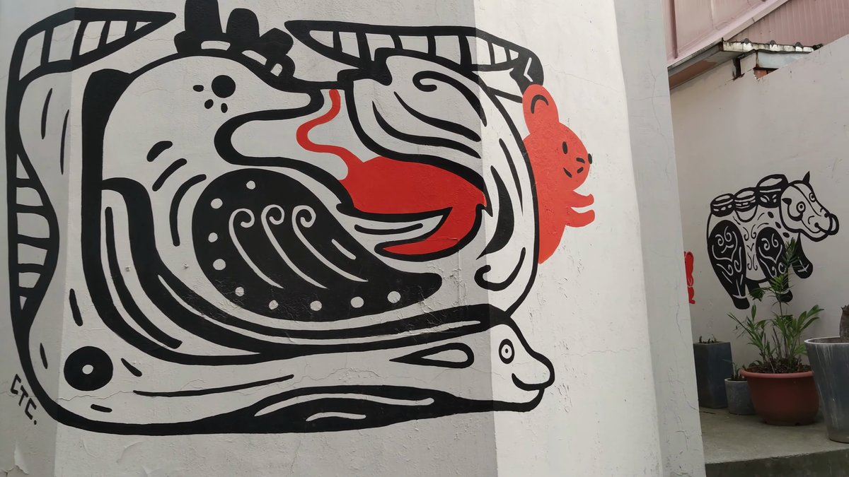 Bold black and red creature mural