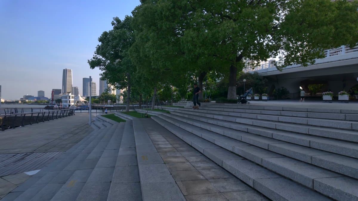 Broad steps dropping toward the river