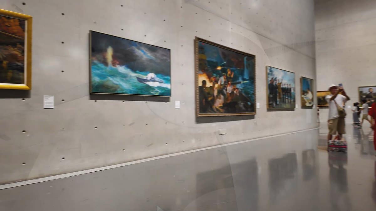 Canvases along the curving wall