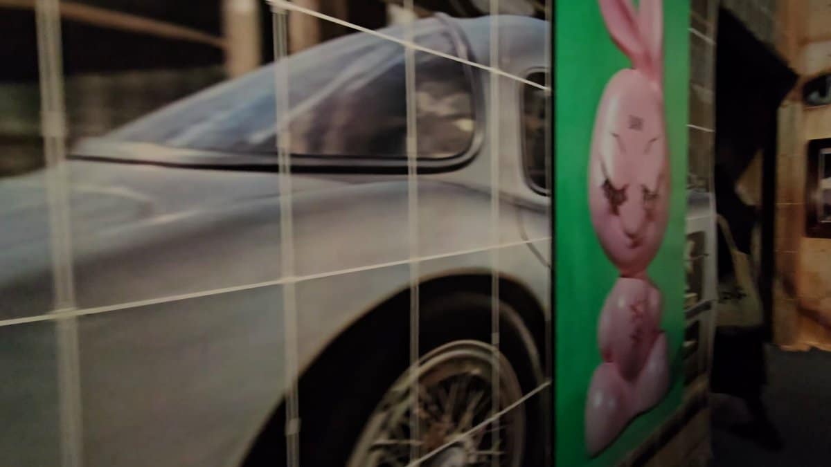 Close on the printed panels — a car