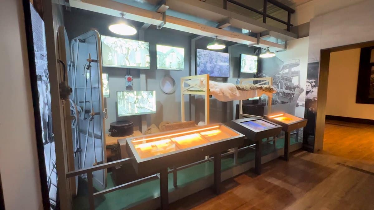 Corridor of lit display cases