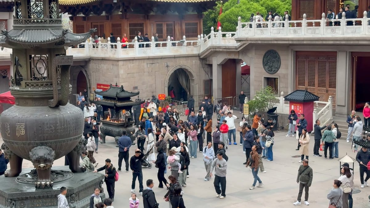Courtyard incense burner and crowds