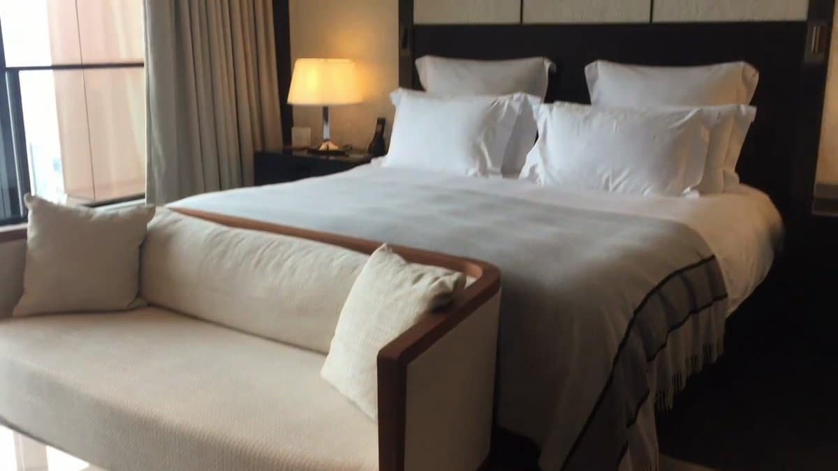 Cream and taupe made-up hotel bed
