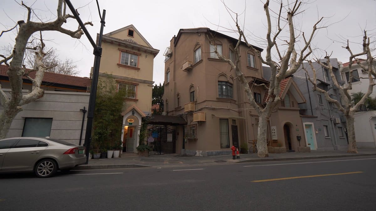 Cream villas among bare trees