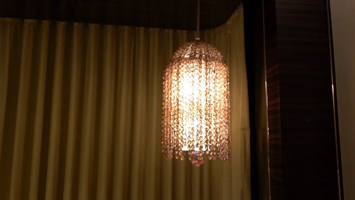 Crystal drum pendant by curtains