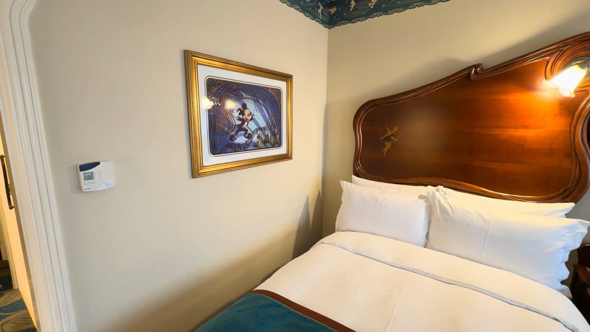 Disney print beside the bed