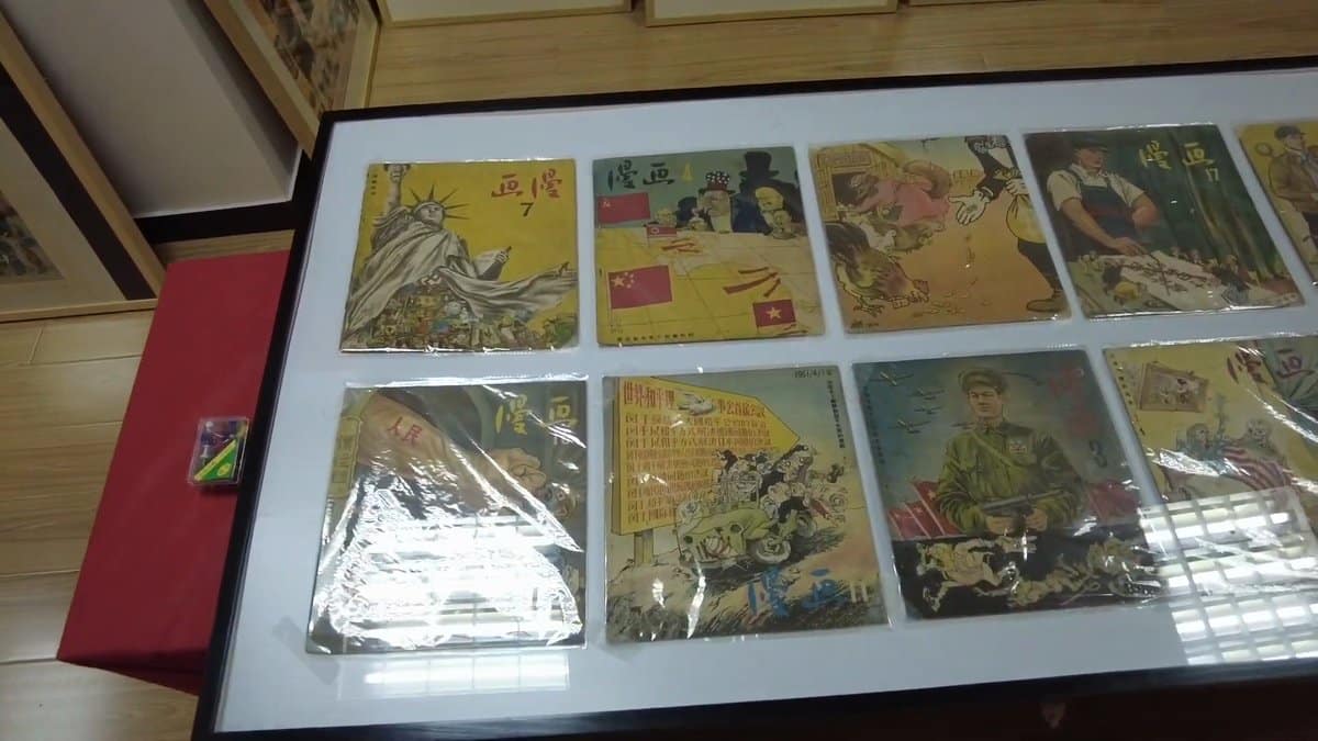 Display case of cartoon prints