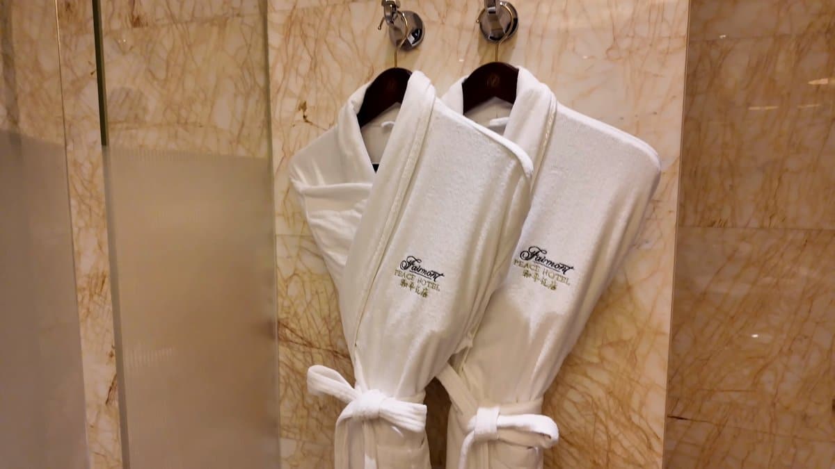 Fairmont-branded white bathrobes