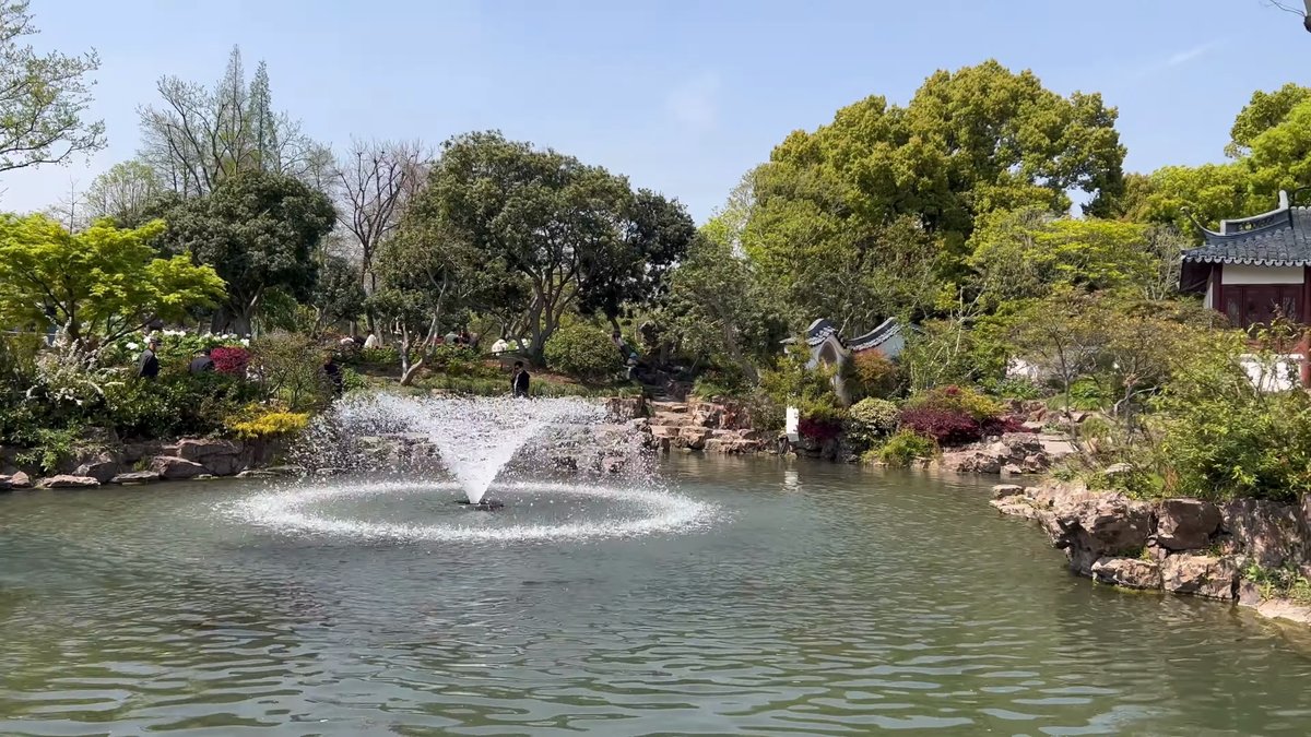 Fountain jet among spring rockery