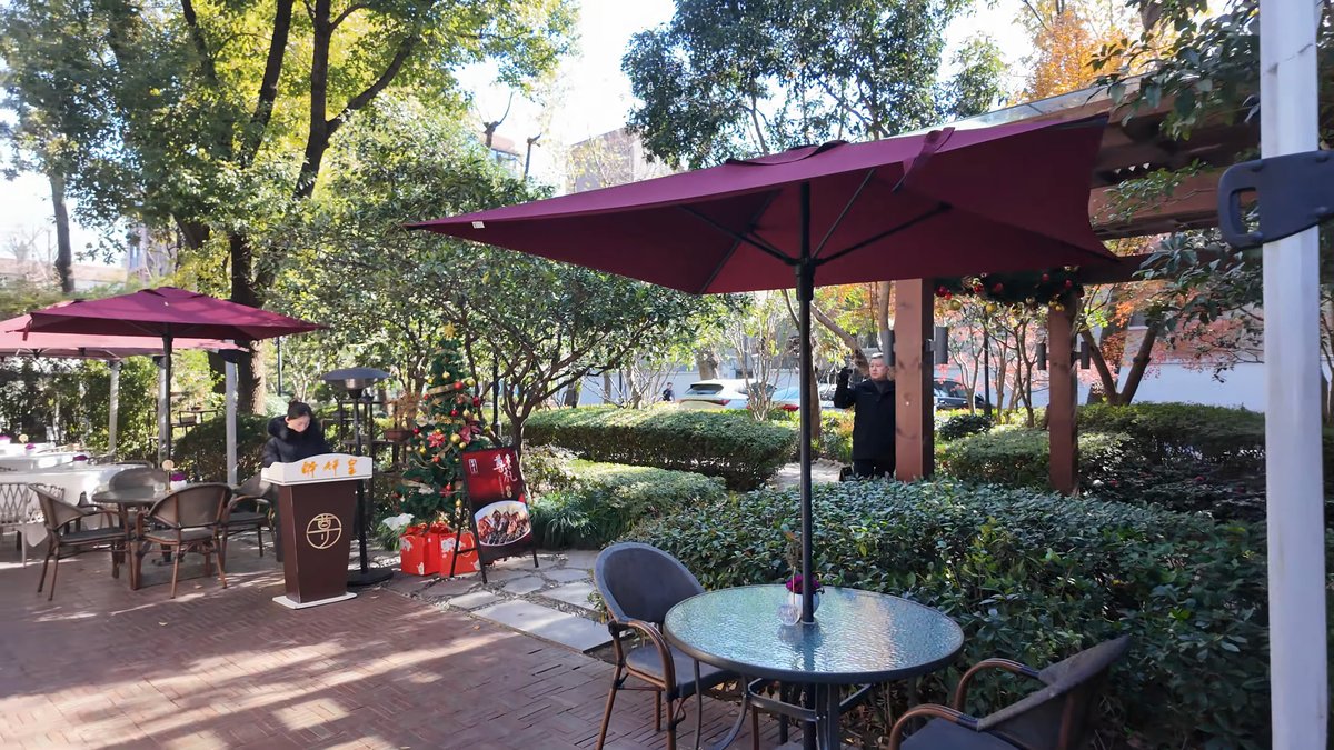 Garden dining terrace with parasols
