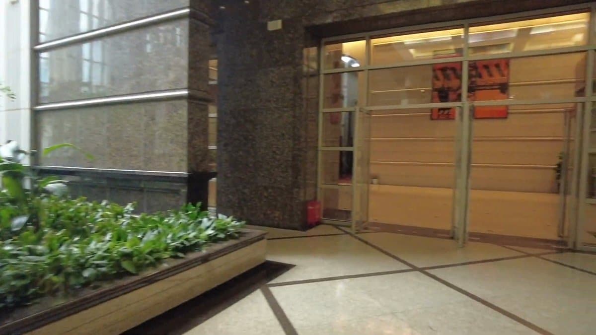 Glass doors leading down to gallery