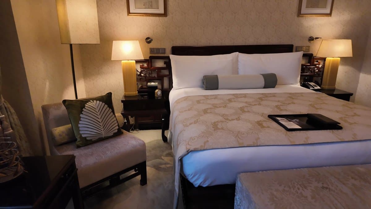 Gold brocade covered guest bed