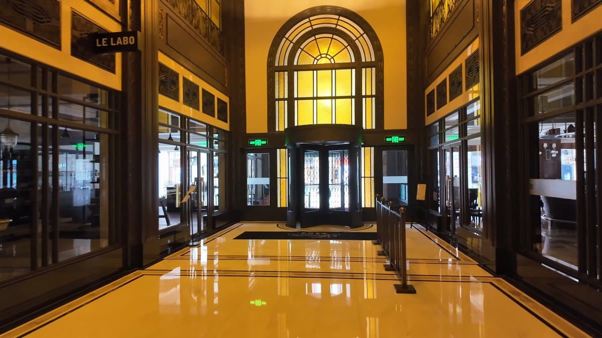Gold-lit corridor with arched window