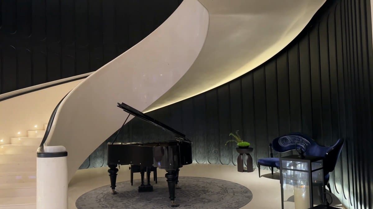 Grand piano under sculptural canopy