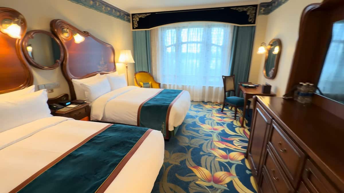 Guest room with carved headboards